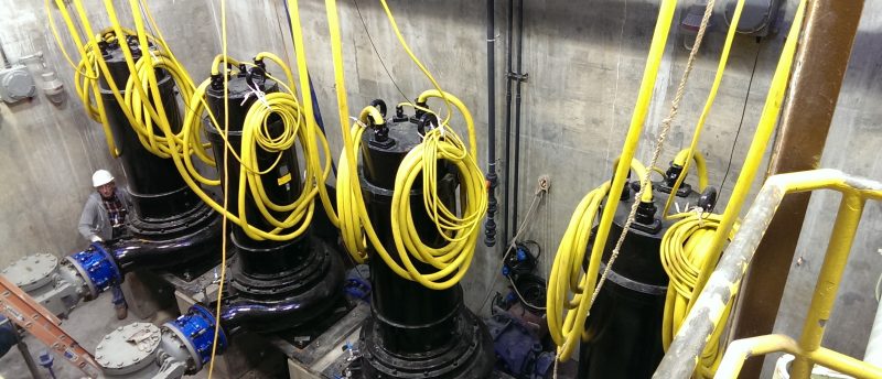 Large municipal pump station with mechanical piping and drive motors